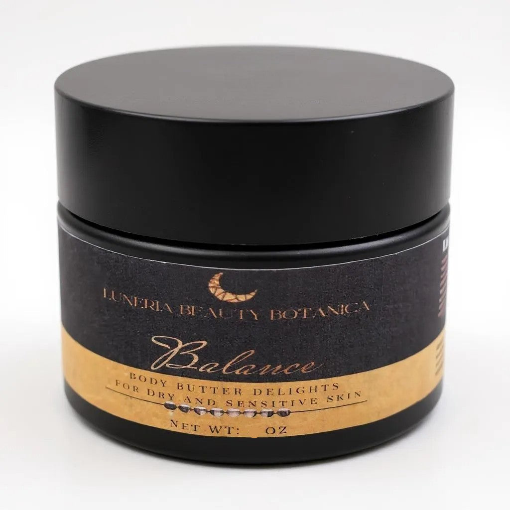 Black jar of 'Balance' body butter by Luneria Beauty Botanica on a white background