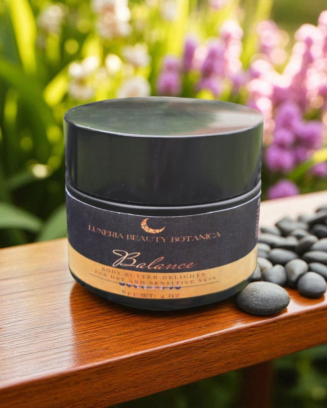 Cosmetic jar labeled 'Luneria Beauty Botanica' on a wooden surface with flowers in the background