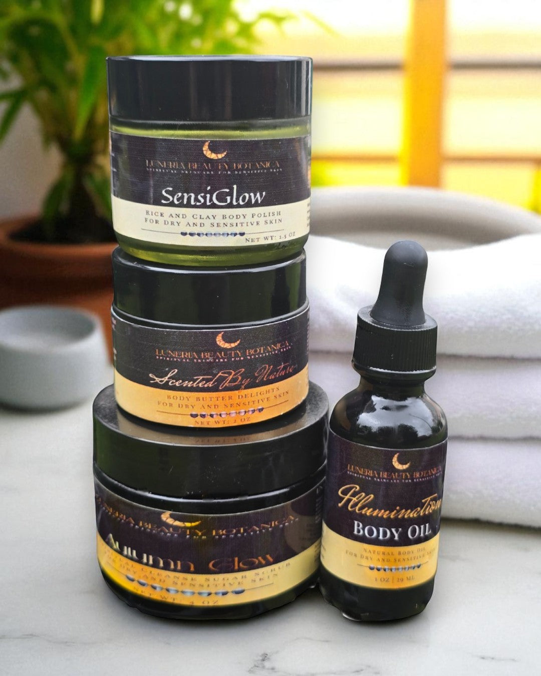 Collection of skincare products including jars and a bottle on a marble surface.