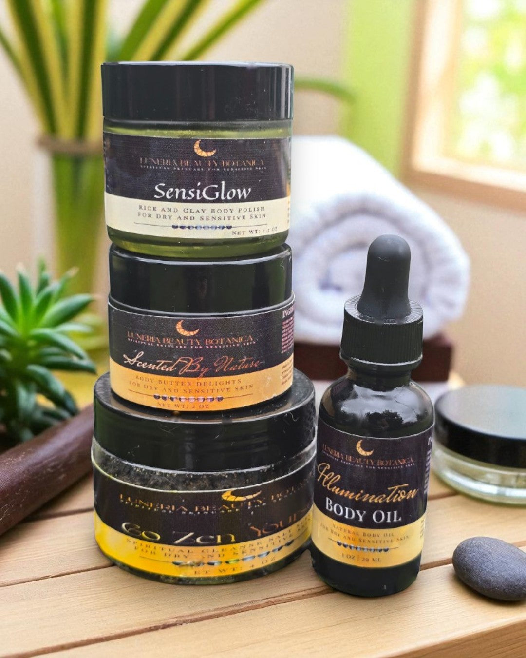 Collection of skincare products including jars and a dropper bottle on a wooden surface with plants in the background.
