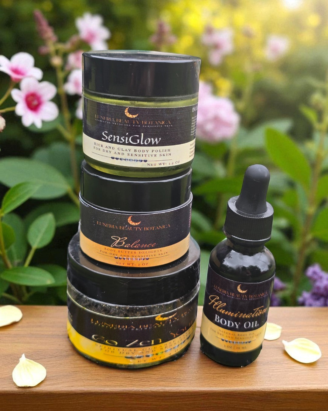 Stack of skincare products with a dropper bottle on a wooden surface with flowers in the background
