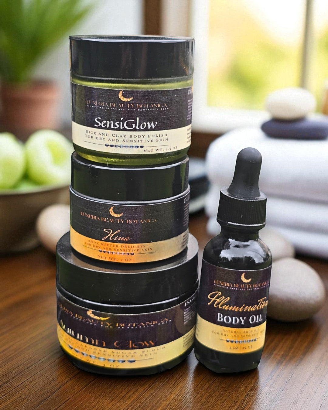 Stack of skincare products with 'Sensiglow' branding on a wooden surface.