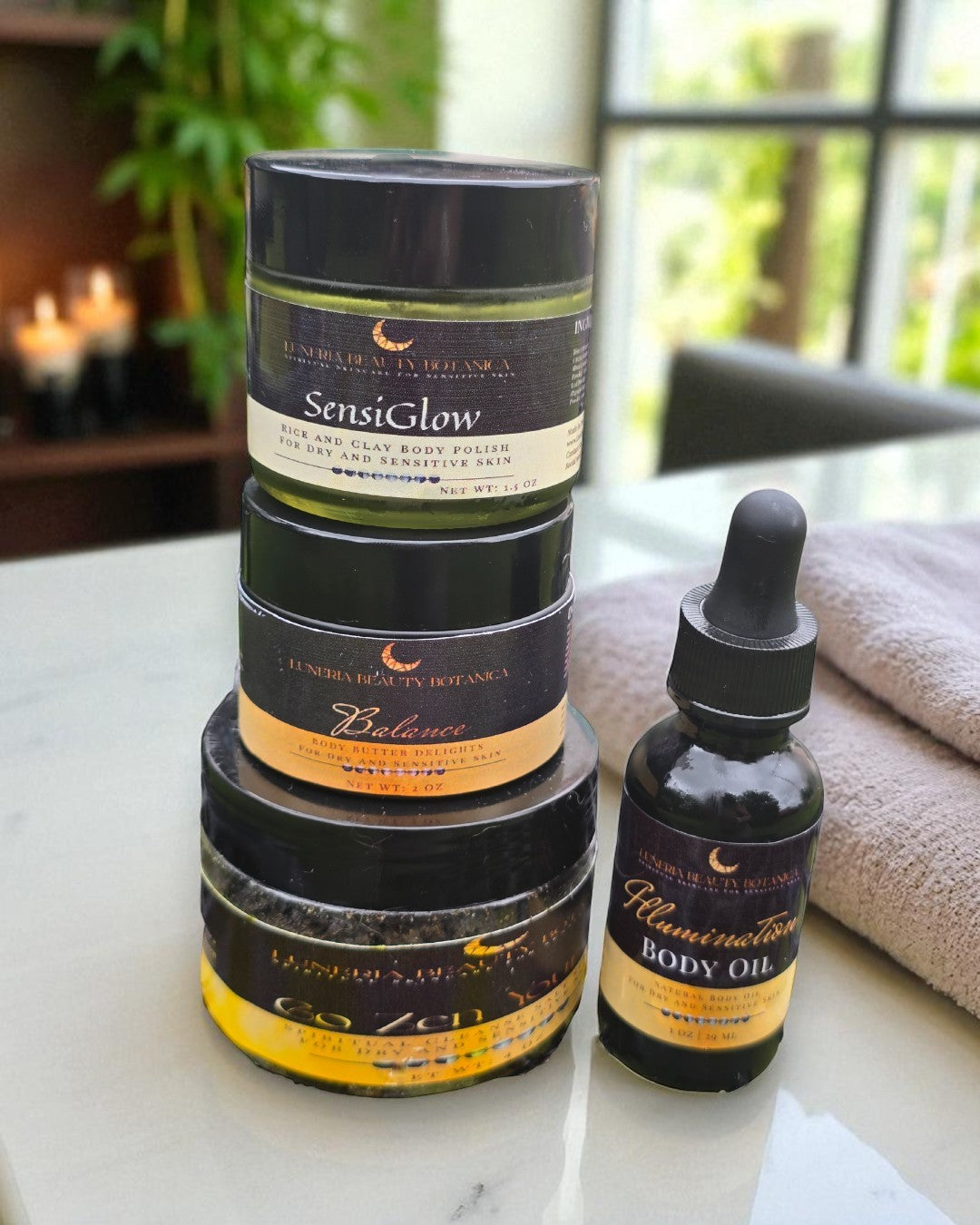 Stack of skincare products on a marble surface with a blurred background
